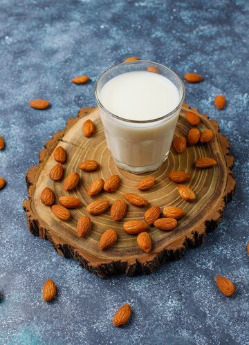 almond-milk-with-almond-top-view_114579-7192