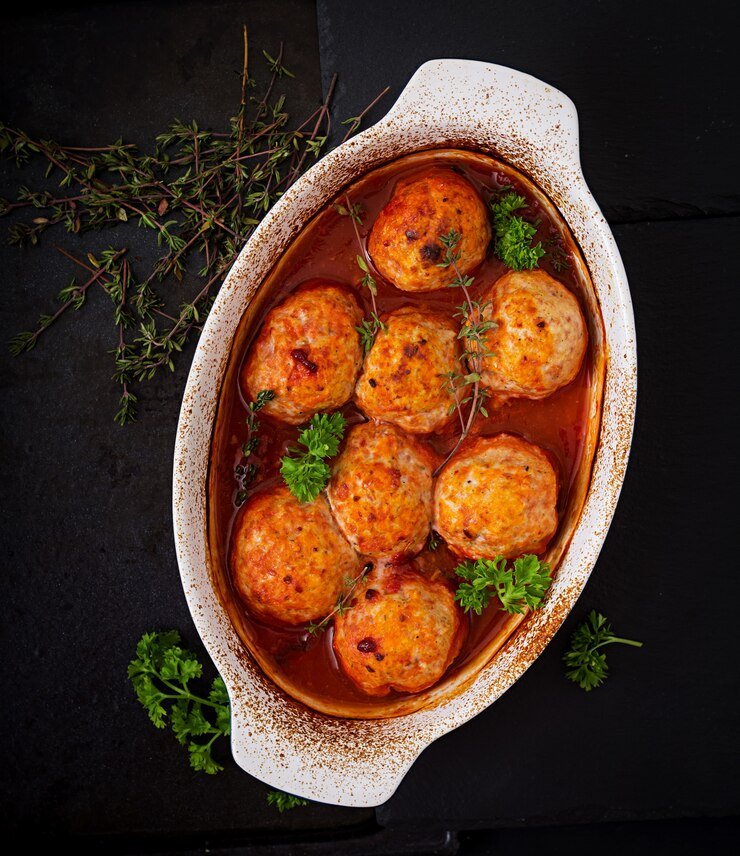 baked-meatballs-chicken-fillet-tomato-sauce_2829-11139