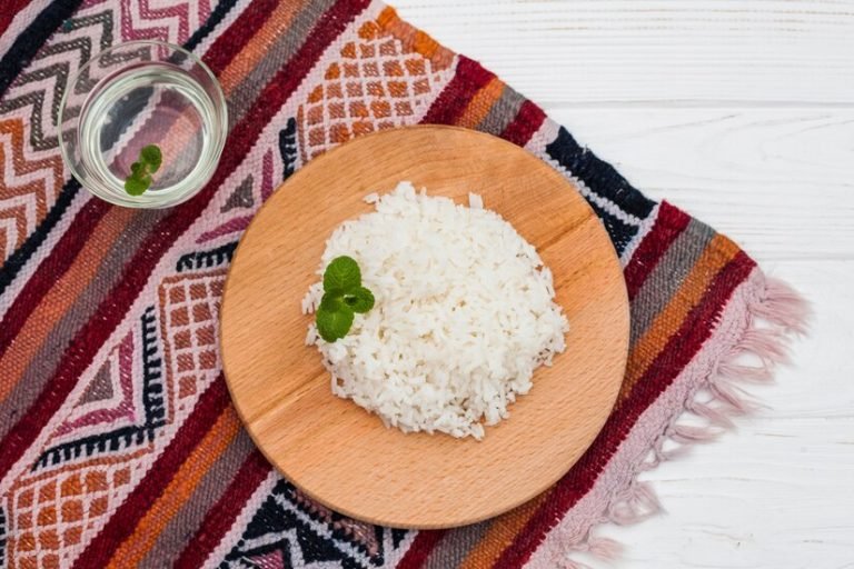 cooked-rice-wooden-board-with-water_23-2148074721