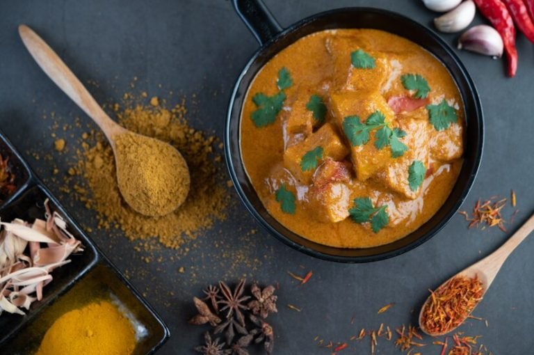 massaman-curry-frying-pan-with-spices-cement-floor_1150-20779